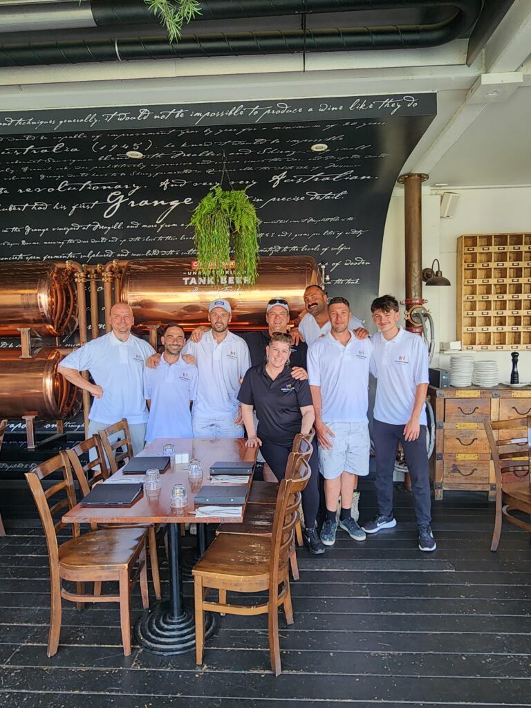 Team photo at a restaurant