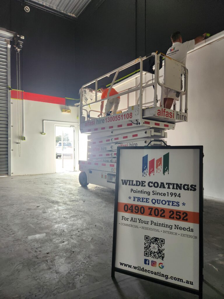 forklift painting in warehouse